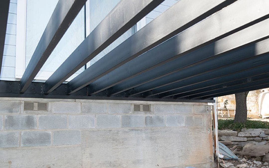 Steel beams supporting a Massachusetts home renovation